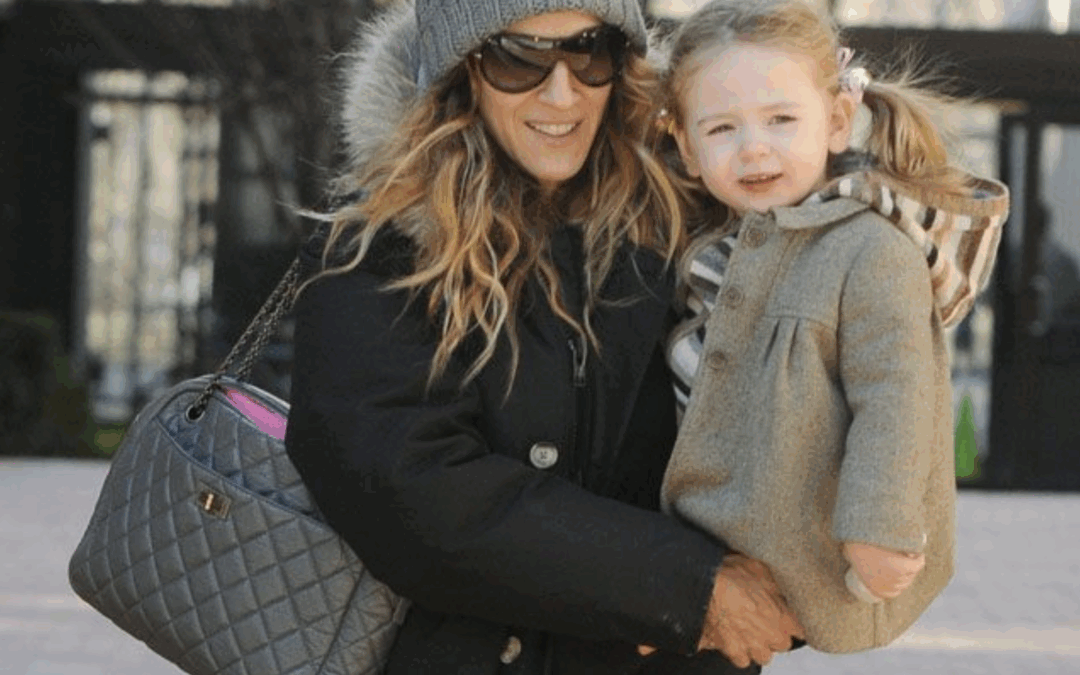 Fashionable mom receiving a CHANEL-inspired handbag for Mother’s Day