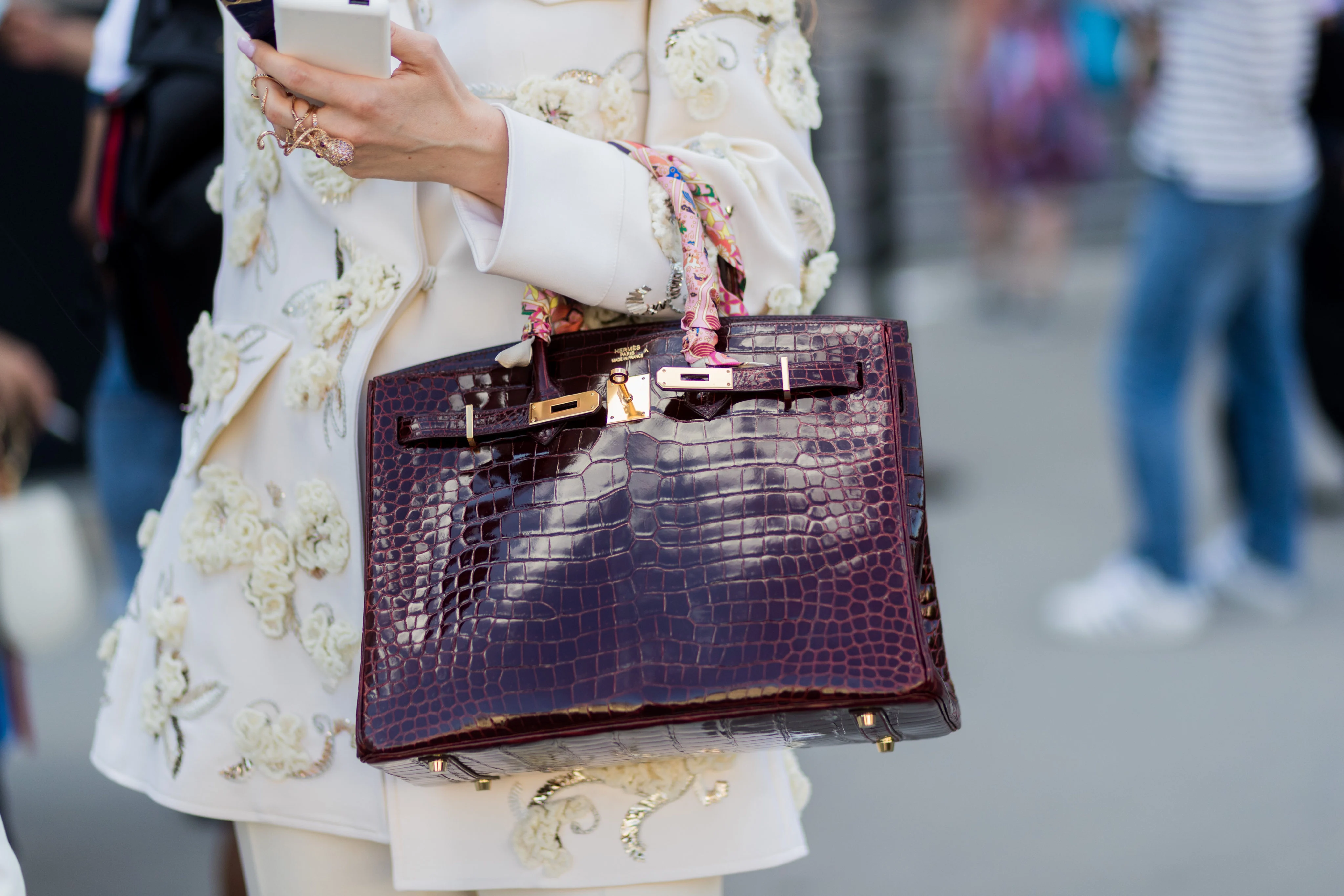 A luxury handbag may complete an outfit, but can it complete a personality?