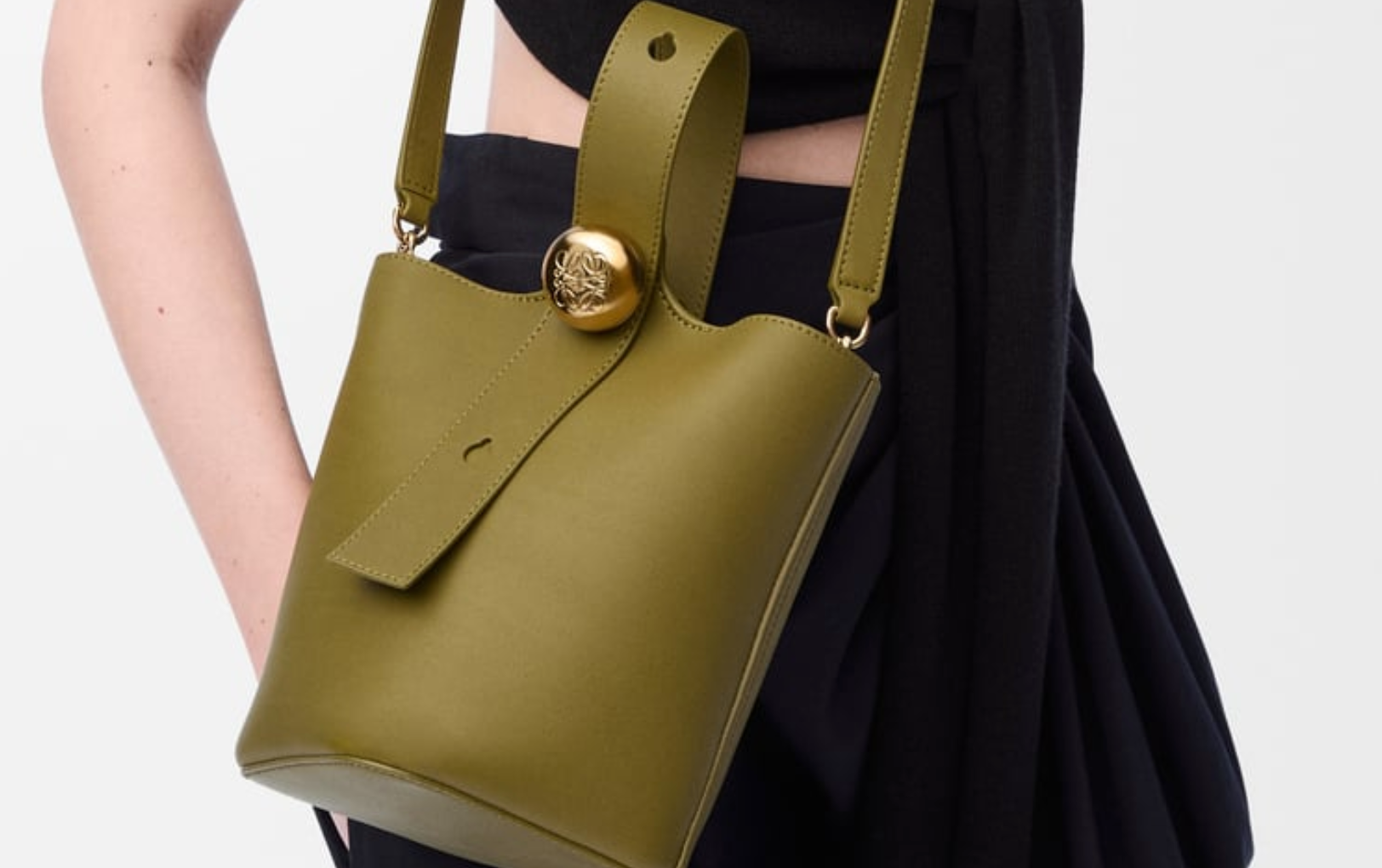 A clean, minimalist product shot of the Mini Pebble Bucket Bag by ALT LUXE