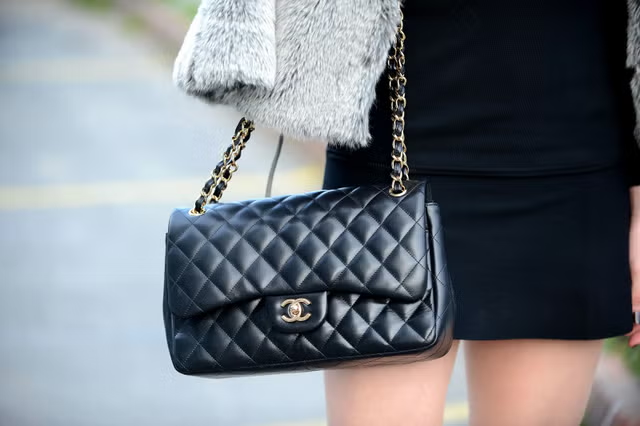 A comparison of a high-end BURBERRY bag next to a stylish replica version