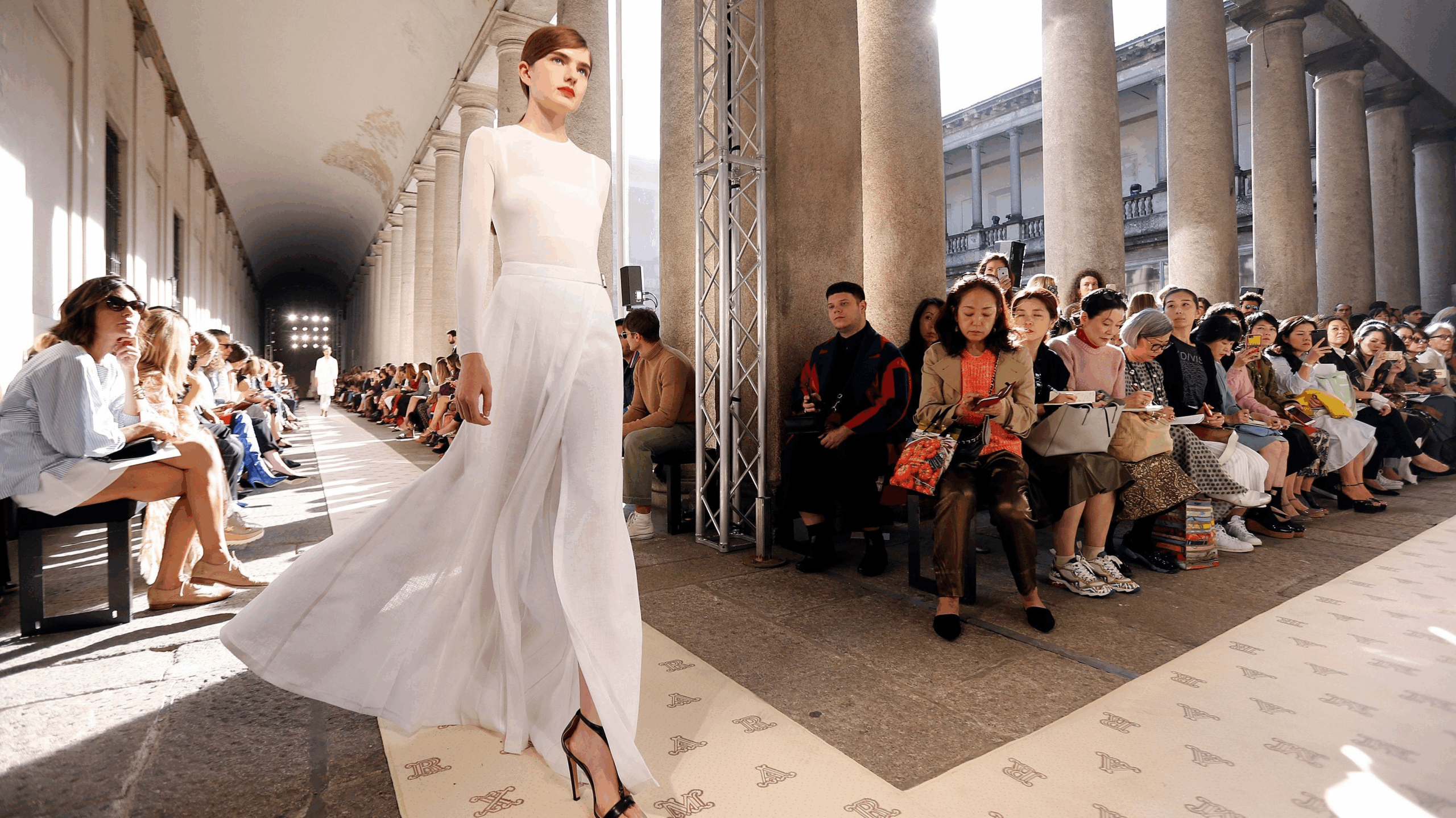 Spotlights and silk on the runway. But who pays the price for luxury? Spotlights and silk on the runway. But who pays the price for luxury?